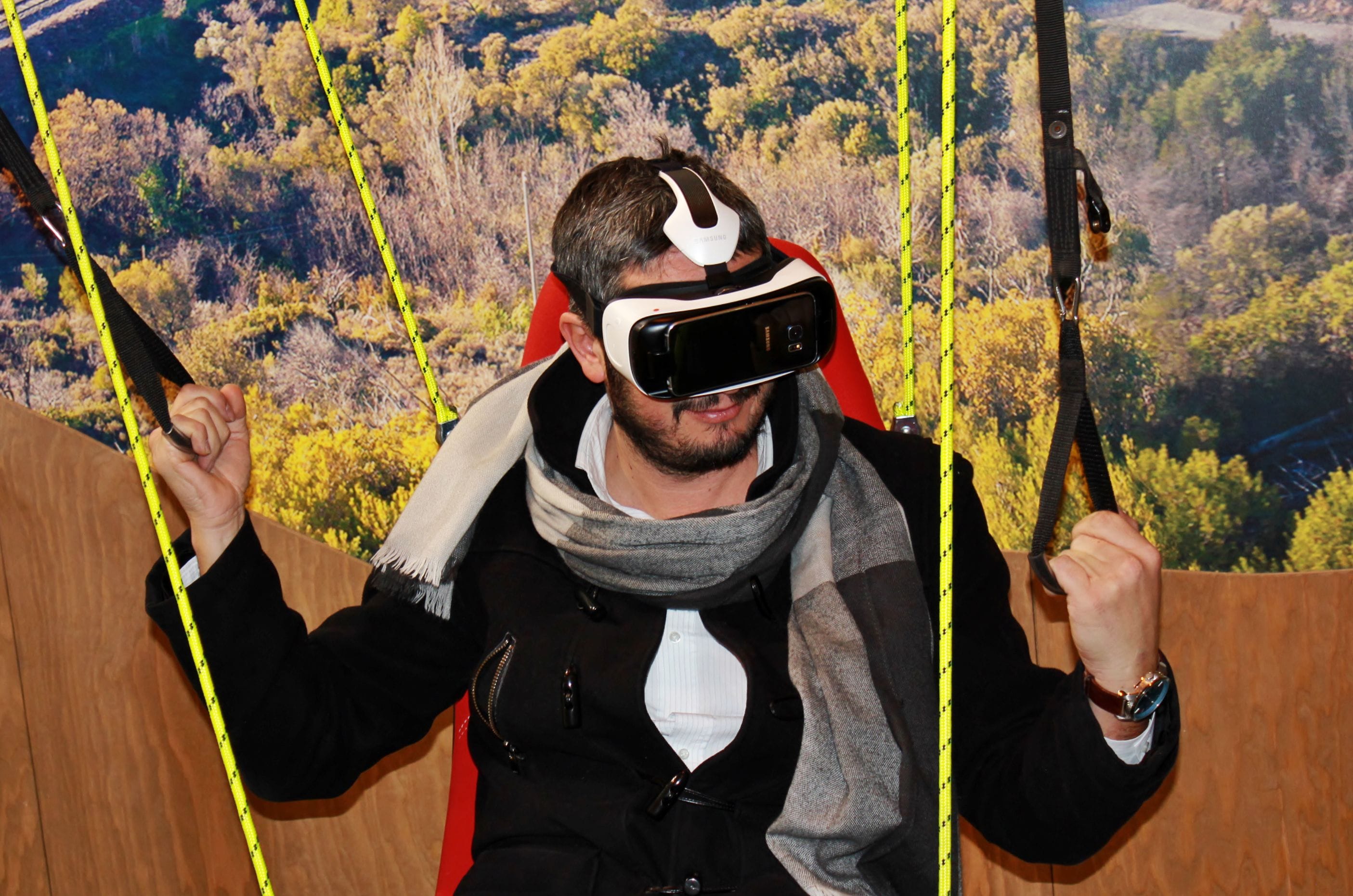 man wearing VR glasses in a mountain scene simulation