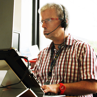 A picture of the Helpline's Alex with headphones on