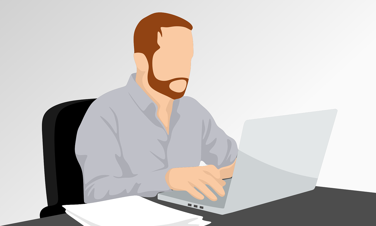 Illustration of a man with a beard looking at a laptop. He has a ginger beard