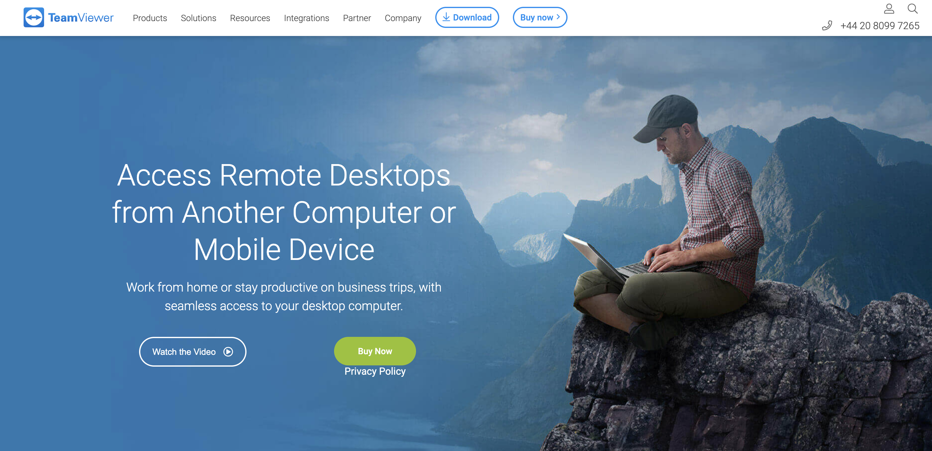 Shows a screenshot of the TeamViewer website a man sits on top of a mountain working on a computer to imply remote support