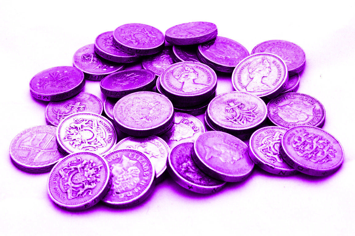 A pile of purple pound coins representing the Purple Pound