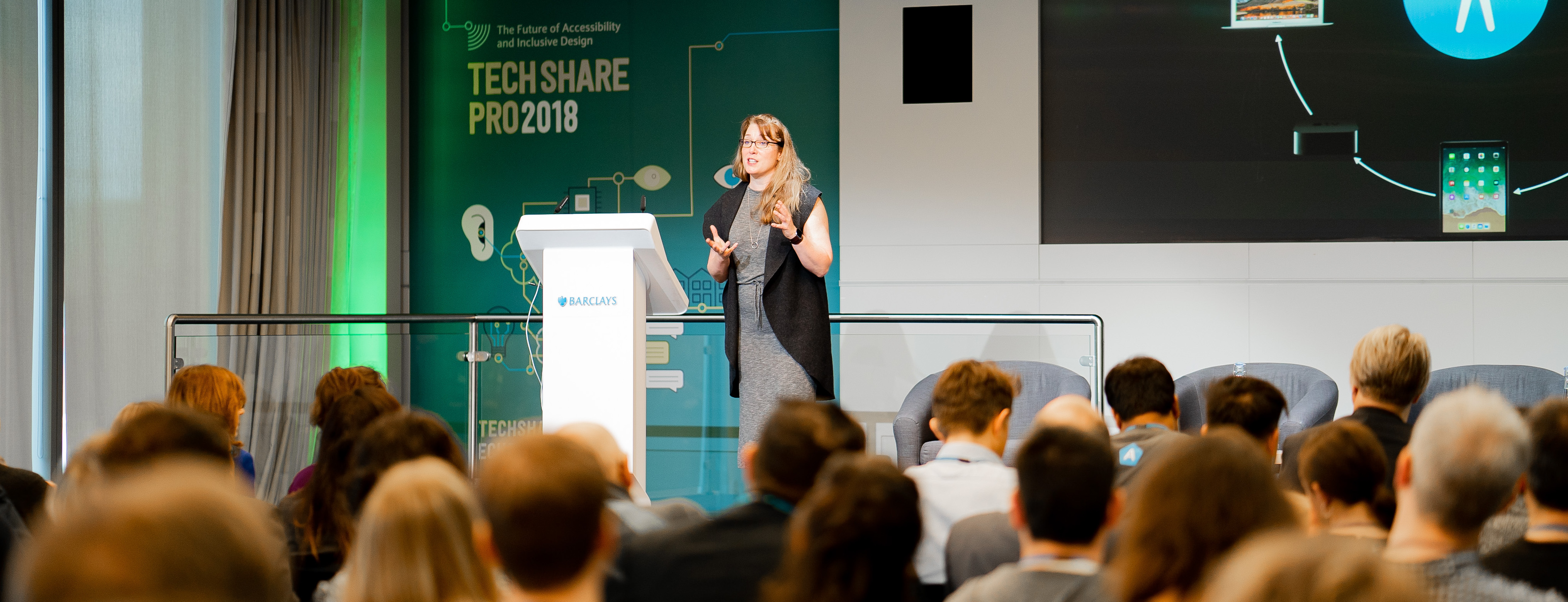 A speaker at TechShare Pro 2018, presenting to attendees